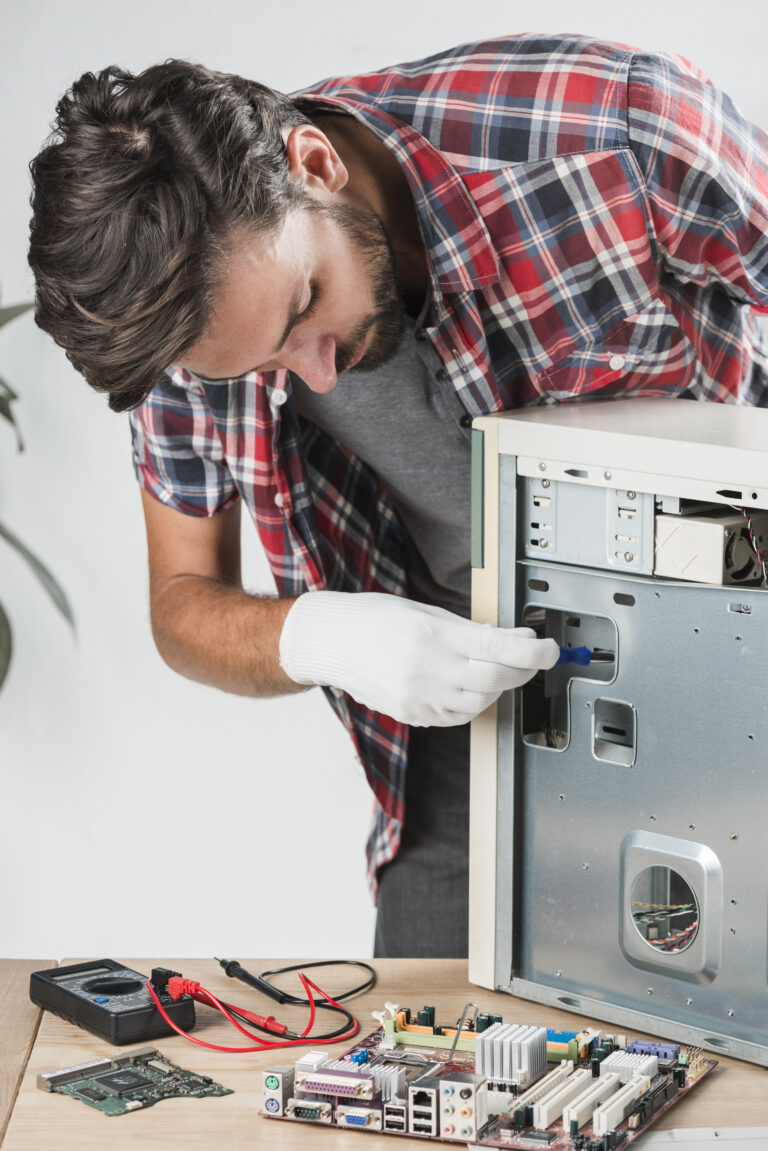 technician examining computer workshop